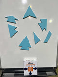 A set of seven magnetic wooden puzzle pieces arranged to form five arrowheads, ready for a group problem-solving activity.