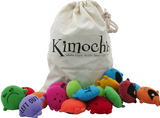 Kimochis Mixed Bag of Feelings set with colorful plush emotion pillows, blank customizable pillows, a feel guide, and a sturdy canvas bag for emotional learning.