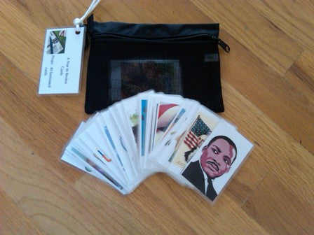 A Year In Review Cards set with 52 laminated cards featuring holiday images and reflective questions, packaged in a mesh envelope.