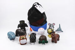 A collection of 13 animal figurines representing different conflict styles, arranged in a circle for group discussion.
