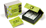 A product image showing Rory Story Cubes. The cubes are visible inside an open green and black box, with a card beside it.