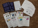 A collection of cards laid out on a surface, with various illustrations and text on them, designed for team and community building activities.
