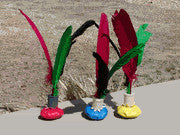 A colorful Funderbird with three feathers and a weighted base, ready for group play.