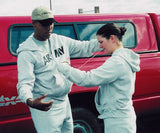 Pairs of human handcuffs made of ropes, neatly stored in a mesh sack, ready for team-building activities.