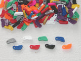 A collection of colorful plastic feet with heart-shaped cutouts, arranged in a circle for group recognition.