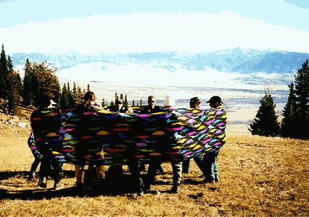 Lycra Tube in vibrant colors, arranged in a loop and used by a group for movement, balance, and cooperative activities.