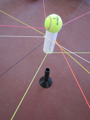 3-D Bull Ring activity set with neon-colored strings, PVC tube, small ball, plastic stand, and mesh stuff sack for team coordination challenges.